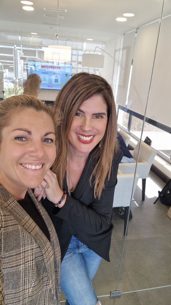 Two smiling community members